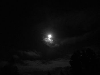Low angle view of moon in sky at night