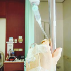 Cropped hand with medical supplies in hospital