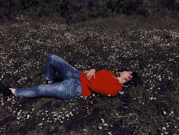 High angle view of man lying on field