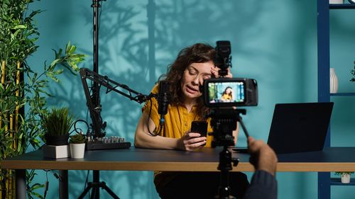 Portrait of young woman using mobile phone