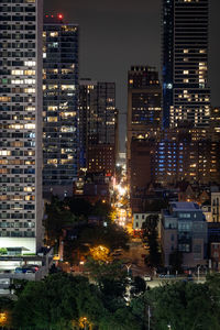 Illuminated buildings in city at night