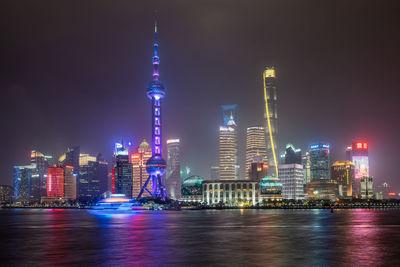 Illuminated buildings in city at night