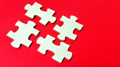 Directly above shot of jigsaw puzzle against yellow background