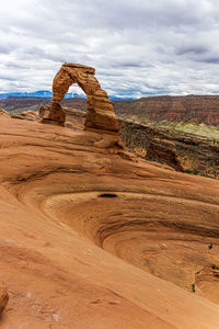 Rock formations on landscape against sky