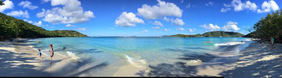 Panoramic view of tourist swimming in sea