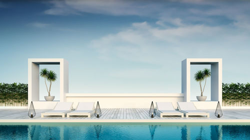 Summer ,beach lounge, sun loungers on sunbathing deck and private swimming pool at luxury villa