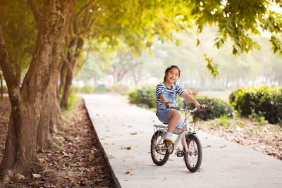 Portrait of smiling girl riding bicycle