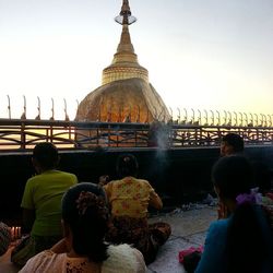 Tourists sitting in water