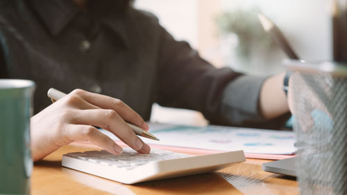 Woman using laptop on table