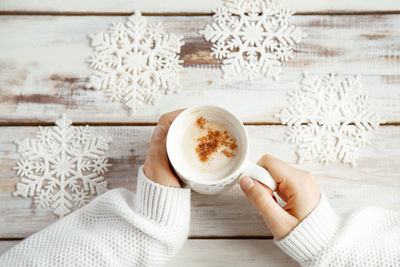 Woman holding coffee cup