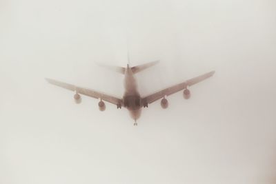 Airplane flying over white background