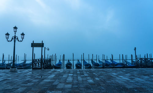 View of pier on sea against cloudy sky