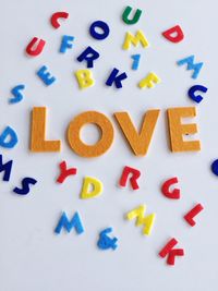 High angle view of multi colored text on table