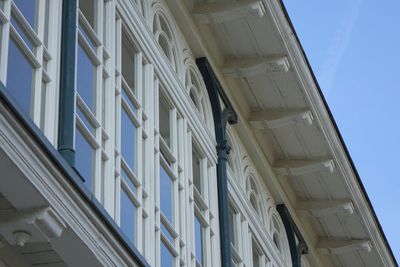 Low angle view of building against clear blue sky