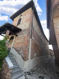 Low angle view of old building against sky