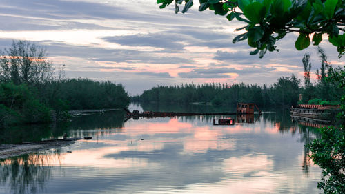 Scenic view of lake against sky during sunset