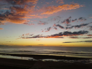 Scenic view of sea against sky at sunset