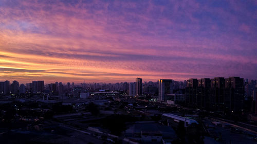 High angle view of city at sunset