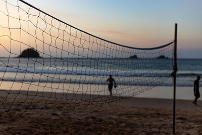 Scenic view of beach against sky during sunset