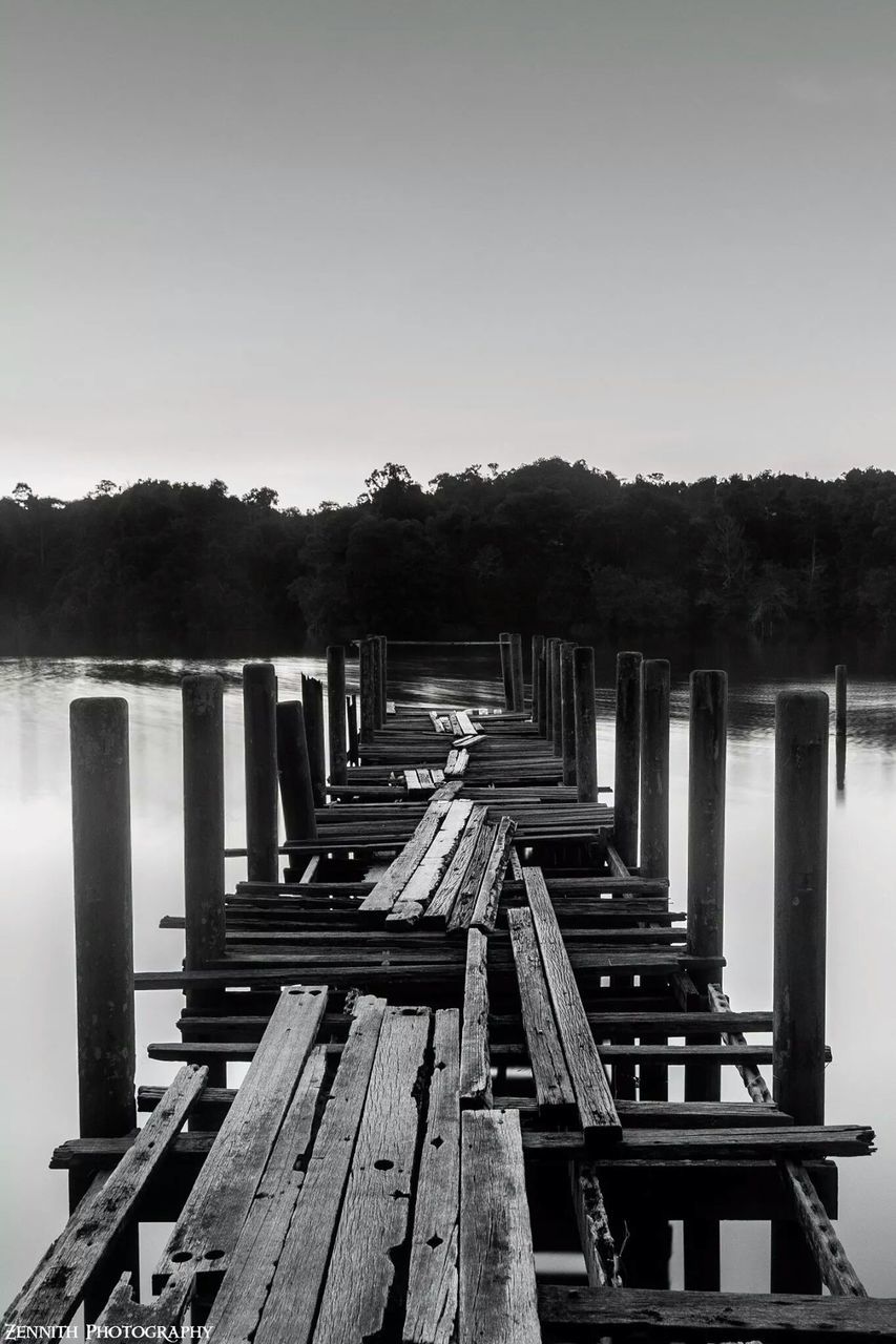 wood - material, wooden, built structure, clear sky, pier, tranquil scene, wood, tranquility, architecture, sky, in a row, nature, copy space, scenics, railing, boardwalk, outdoors, no people, day, water