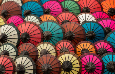 Full frame shot of multi colored umbrellas at market