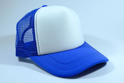 High angle view of hat on table against white background