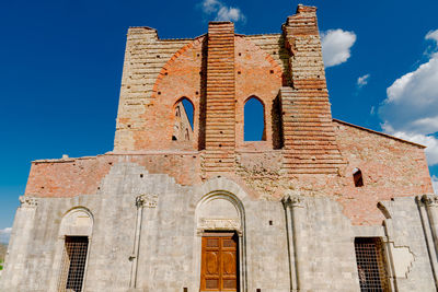 Low angle view of historical building against blue sky