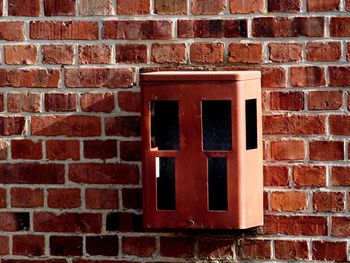 Red window on brick wall