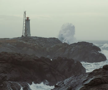 Lighthouse on stormy day landscape photo
