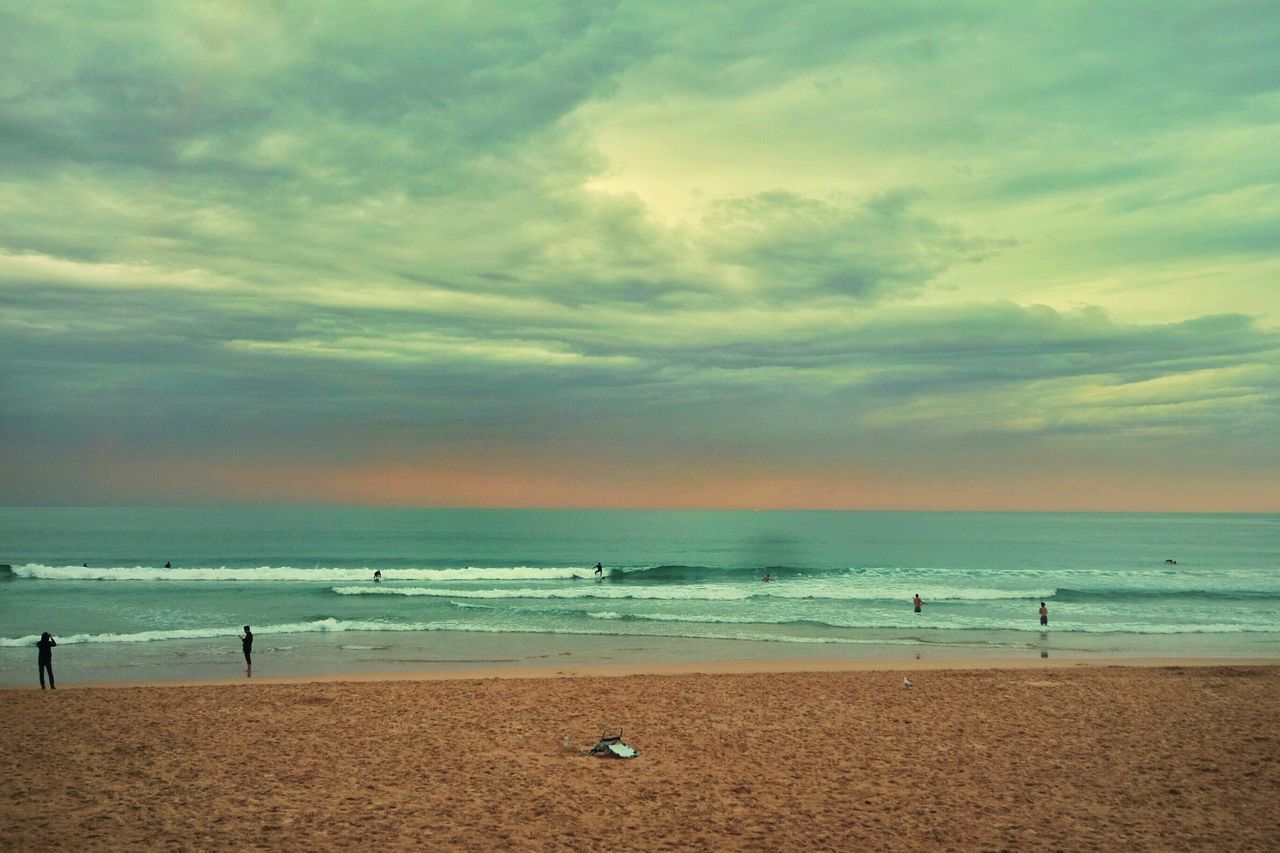 sea, beach, horizon over water, sky, water, shore, sand, scenics, beauty in nature, tranquil scene, tranquility, cloud - sky, nature, idyllic, sunset, incidental people, cloud, vacations, cloudy, wave