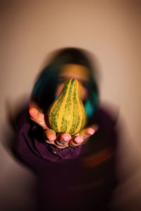 Close-up of woman holding glass