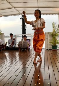 People sitting on wooden floor