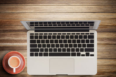 Directly above shot of coffee cup on table