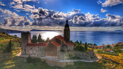 Panoramic view of buildings and houses against sky