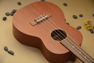 Close-up of guitar on table