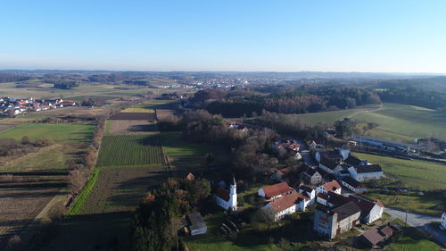 High angle view of agricultural field against clear sky