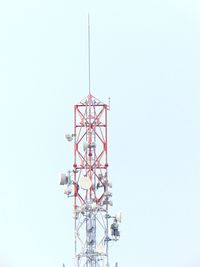 Low angle view of communications tower against clear sky