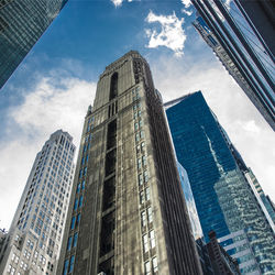 Low angle view of modern buildings against sky in city