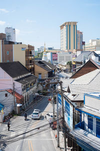High angle view of buildings in city against sky