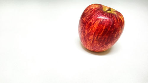 High angle view of apple against white background