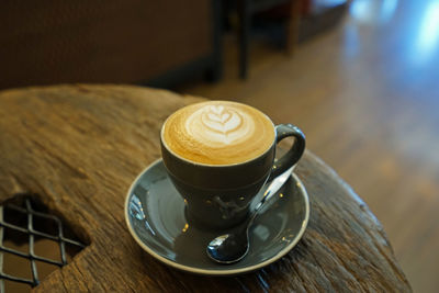 Close up hot mug of hot latte coffee