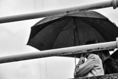 Close-up of wet hand in rainy season