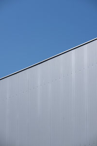 Low angle view of building against blue sky