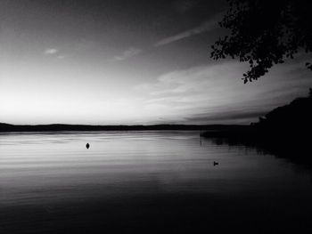 Scenic view of sea against sky at dusk