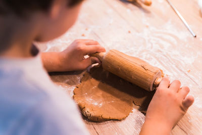 Cropped hands of man working on table