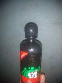 Close-up of bottle against wall