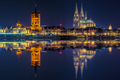 Reflection of illuminated buildings in water