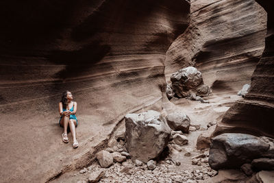 High angle view of people walking on rock