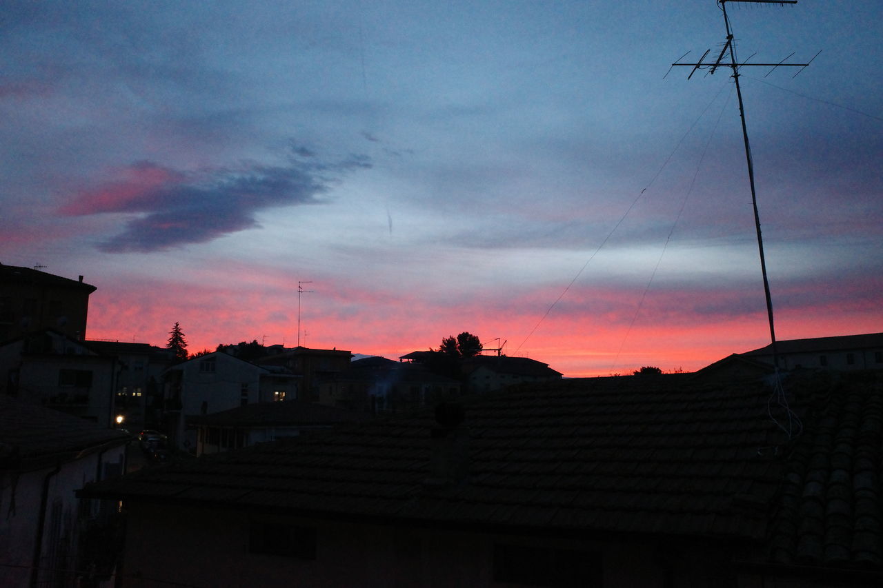 LOW ANGLE VIEW OF SILHOUETTE BUILDINGS AGAINST SKY