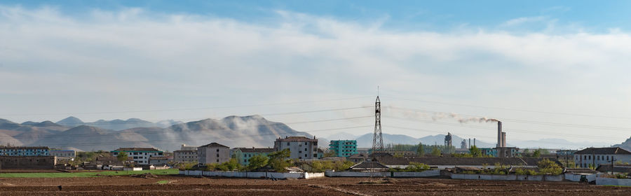 View of buildings against cloudy sky